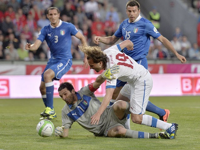Italy's keeper Gianluigi Buffon saves a ball from Czech's Petr Jiracek during the World Cup qualifying match on June 7, 2013