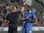 Italy's Mario Balotelli receives the red card from referee Svein Oddvar Moen during the World Cup qualifying match against the Czech Republic on June 7, 2013