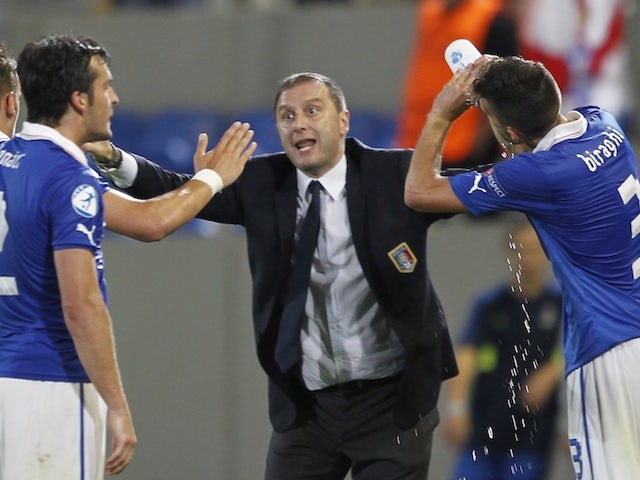 Italy coach Devis Mangia gestures after his side score against England on June 5, 2013
