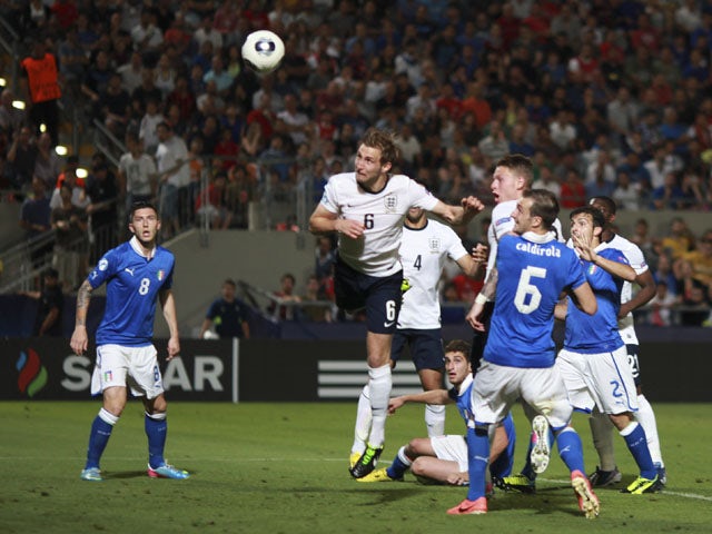England's Craig Dawson scores a goal that was ruled out during the U21 match against Italy on June 5, 2013