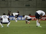 England players stand dejected after defeat to Norway on June 8, 2013