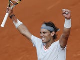 Spain's Rafael Nadal celebrates defeating Switzerland's Stanislas Wawrinka in three sets in their Quarter Final match of the French Open tennis tournament on June 5, 2013