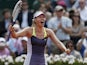Russia's Maria Sharapova celebrates winning against Serbia's Jelena Jankovic in three sets during their Quarter Final match of the French Open tennis tournament on June 5, 2013