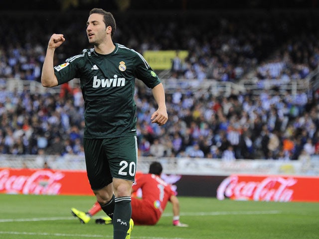 Real Madrid's Gonzalo Higuain celebrates after scoring against Real Sociedad on May 26, 2013