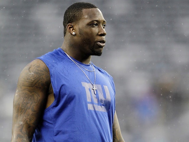 Giants defensive end Jason Pierre-Paul warms up for a game with New Orleans on December 9, 2012