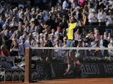  Jo-Wilfried Tsonga celebrates his French Open win over Roger Federer on June 4, 2013