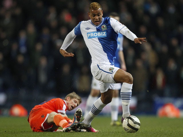 Blackburn Rovers Joshua King gets away from Millwall's Andrew Keogh during the FA Cup Quarter Final Replay on March 13, 2013