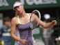 Maria Sharapova reacts to a shot played by Serena Williams during the French Open final on June 8, 2013