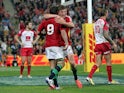 Lions' Owen Farrell and Ben Youngs celebrate a try against Queensland Reds on June 8, 2013