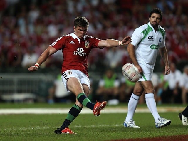Lions' Owen Farrell kicks during the game with the Barbarians on June 1, 2013