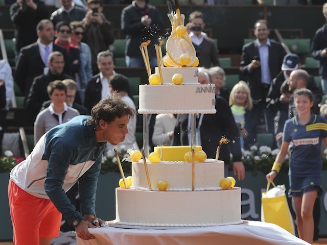 Spanish ace Rafa Nadal celebrates his birthday win over Kei Nishikori on June 3, 2013