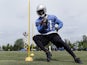 Lions' RB Reggie Bush runs a practice drill on May 30, 2013