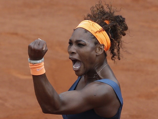 Serena Williams celebrates winning the first set of the French Open final against Maria Sharapova on June 8, 2013