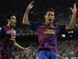 Thiago celebrates his goal for Barcelona with Pedro.