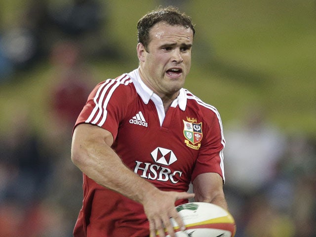 British and Irish Lions' Jamie Roberts runs with the ball during their rugby tour match against NSW and QLD combined country on June 11, 2013