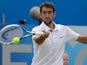 Marin Cilic returns the ball to Tomas Berdych during their quarter final match at Queens on June 14, 2013