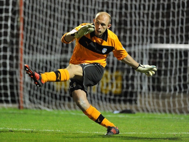 Colchester's Mark Cousins in action against Northampton on October 9, 2012