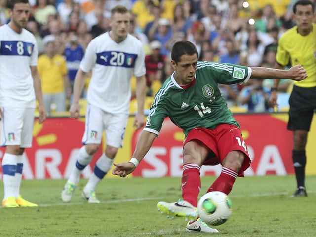 Mexico's Javier Hernandez scores from the penalty spot during the soccer Confederations Cup group A match between Mexico and Italy on June 16, 2013