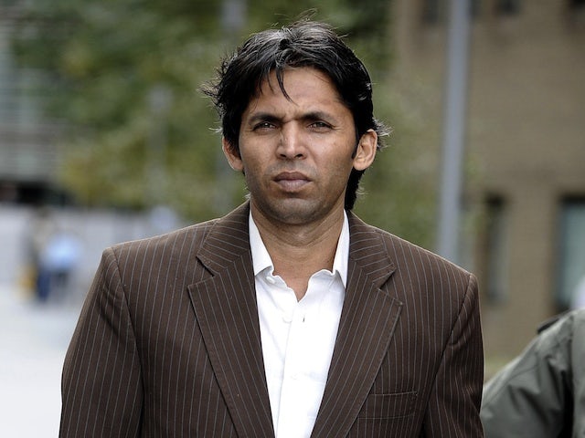 Pakistan's Mohammad Asif leaves court on June 12, 2013