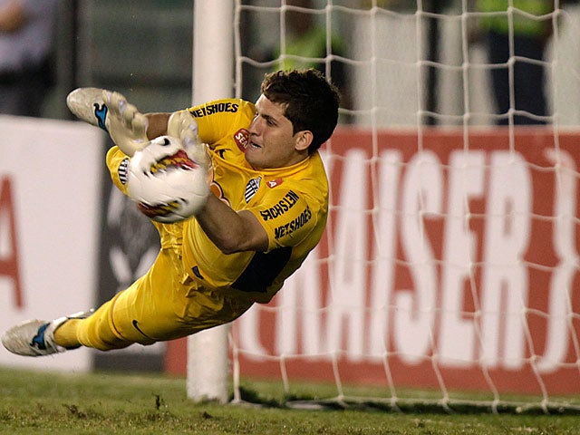 Santos' goalkeeper Rafael saves a penalty on May 24, 2012