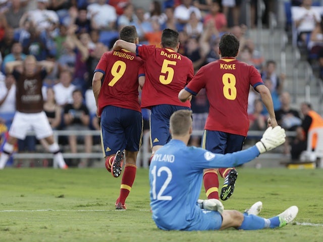 Spain's players celebrate a goal against Russia on June 15, 2013