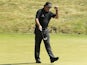 Phil Mickelson reacts after his birdie putt on the ninth hole during the first round of the U.S. Open golf tournament on June 13, 2013