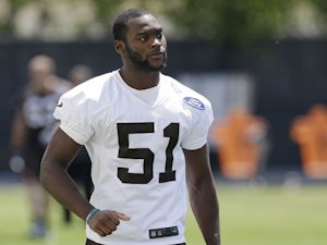 Cleveland Browns linebacker Barkevious Mingo walks off the field after minicamp practice on June 4, 2013