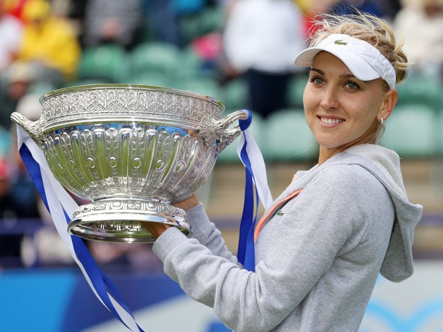 Russia's Elena Vesnina lifts the tournament trophy after winning the final match against USA's Jamie Hampton during the AEGON International on June 22, 2013