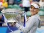 Russia's Elena Vesnina lifts the tournament trophy after winning the final match against USA's Jamie Hampton during the AEGON International on June 22, 2013