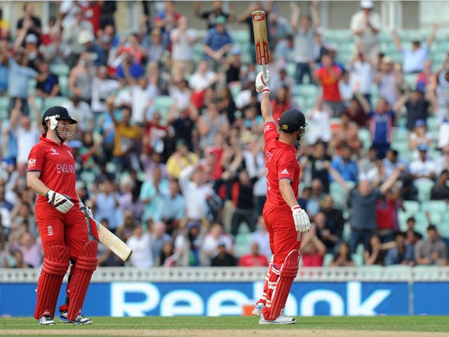 Jonathan Trott celebrates hitting the winning runs during the ICC Champions Trophy semi final against South Africa on June 19, 2013