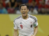 Japan's Shinji Okazaki celebrates scoring his side's 3rd goal during the Confederations Cup match against Italy on June 19, 2013