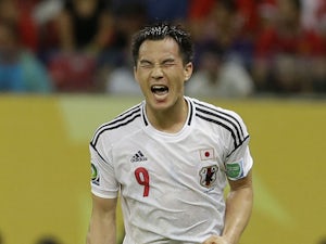 Japan's Shinji Okazaki celebrates scoring his side's 3rd goal during the Confederations Cup match against Italy on June 19, 2013