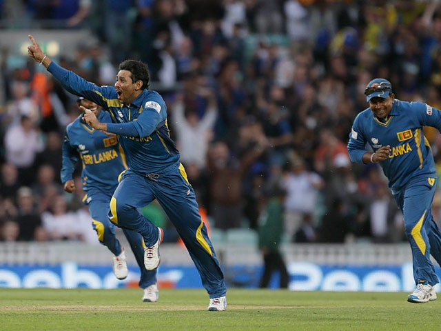 Sri Lanka's Tilakaratne Dilshan celebrates moments after catching out Australia's Clint McKay during the ICC Champions Trophy on June 17, 2013