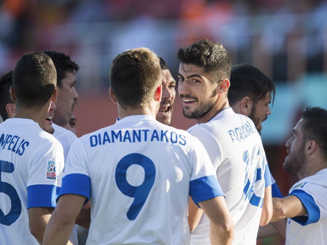 Greece's Andreas Bouchalakis celebrates scoring his side's first goal during the Under-20 World Cup match against Mexico on June 22, 2013