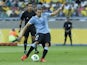 Uruguay's Diego Forlan shoots from the penalty spot but fails to score during the soccer Confederations Cup semifinal match between Brazil and Uruguay on June 26, 2013