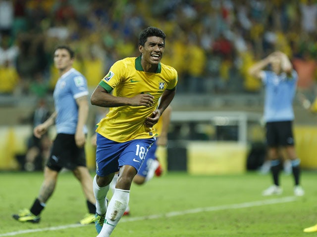 Brazil's Paulinho celebrates scoring his side's 2nd goal during the soccer Confederations Cup semifinal match between Brazil and Uruguay on June 26, 2013
