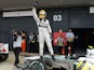 Mercedes driver Lewis Hamilton celebrates after taking pole during qualifying for the British Grand Prix on June 29, 2013