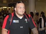 Wales' Craig Mitchell arrives back at Heathrow Airport on October 23, 2011