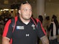 Wales' Craig Mitchell arrives back at Heathrow Airport on October 23, 2011