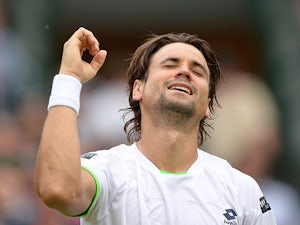 David Ferrer celebrates after beating Alexandr Dolgopolov during their Wimbledon match on June 29, 2013
