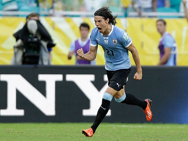 Uruguay's Edinson Cavani celebrates after scoring his second goal against Italy during the Confederations Cup on June 30, 2013