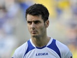 Bosnia's Emir Spahic stands during the playing of the national anthems before the start of World Cup 2014 Group G qualification match between Latvia and Bosnia on June 7, 2013