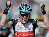 Jan Bakelants celebrates after crossing the finish line to win the second stage of the Tour de France on June 30, 2013