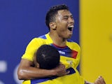 Ecuador's Jefferson Montero celebrates his goal with Antonio Valenciaduring the second half of an international friendly soccer match against Chile on August 15, 2012