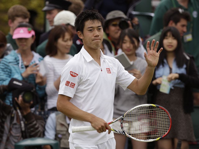Kei Nishikori of Japan reacts after beating Leonardo Mayer of Argentina during their Men's second round singles match on June 27, 2013