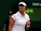 China's Li Na celebrates against Netherland's Michaella Krajicek during the first round match at Wimbledon on June 25, 2013