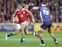 British and Irish Lions Simon Zebo runs past Mitch Inman of the Melbourne Rebels of Australia during their rugby match on June 25, 2013