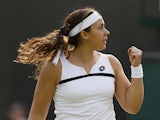 Marion Bartoli of France reacts after winning a point against Christina McHale of the United States during the third day of the Wimbledon Tennis Championships on June 26, 2013