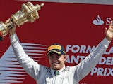 Nico Rosberg celebrates on the podium after winning the British Grand Prix at Silverstone on June 30, 2013