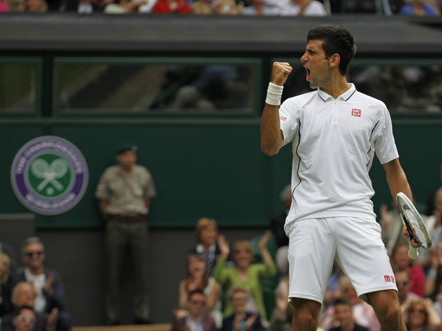 Novak Djokovic of Serbia reacts after winning a set against Florian Mayer of Germany during their Men's first round singles match on June 25, 2013